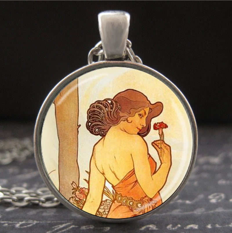 Round framed art pendant necklace with floral portrait and red flower detail