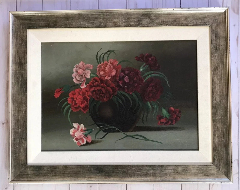Framed oil painting of carnation bouquet with vase, pink and red flowers