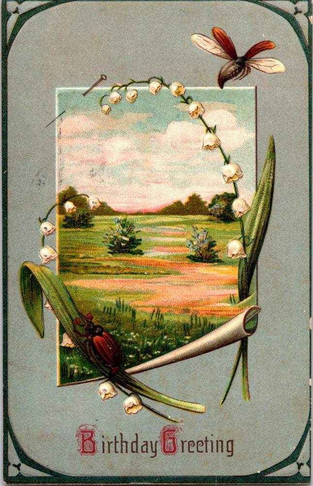 Birthday greeting postcard with embossed lilies of the valley and butterfly decoration