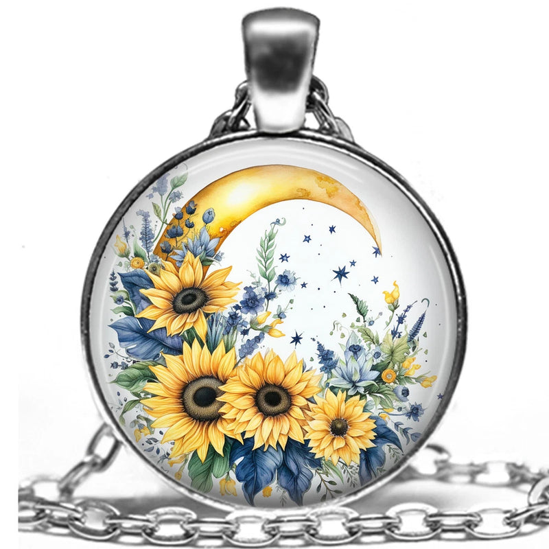 Round silver-tone pendant necklace with sunflower, blue floral, and crescent moon charm