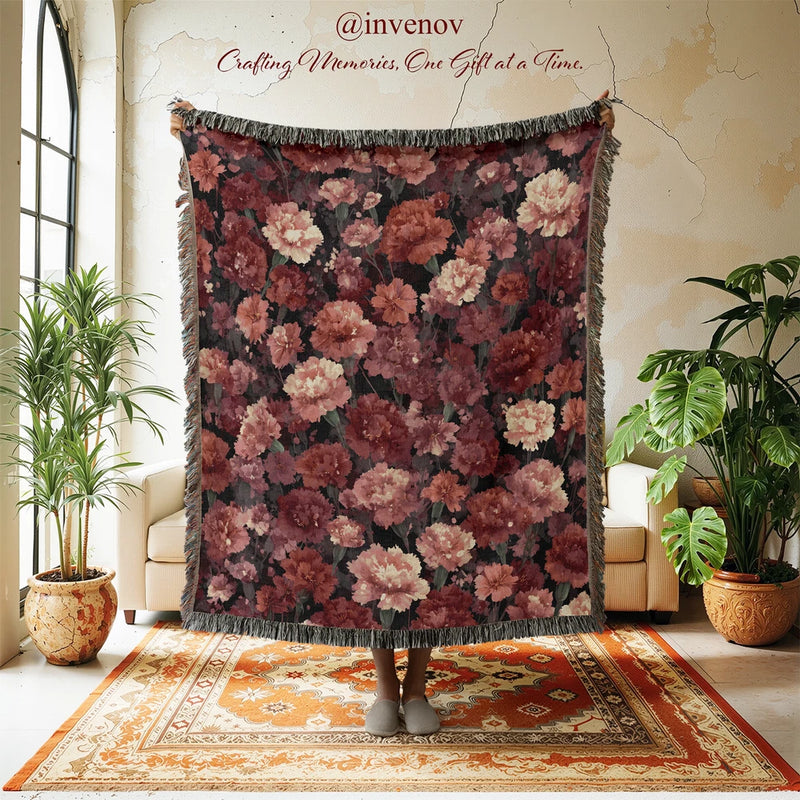 Burgundy and pink floral woven blanket with fringed border, carnation pattern tapestry