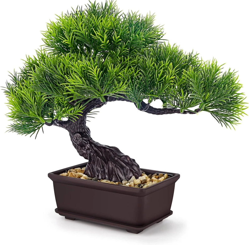 Small artificial bonsai tree in dark brown rectangular pot with green foliage