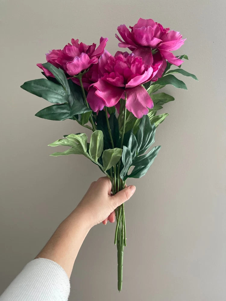 Artificial peony floral spray bouquet with pink-magenta blooms and green leaves